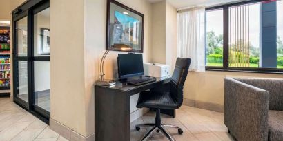 Business center with computer, printer and ergonomic chair at Comfort Inn Newmarket.