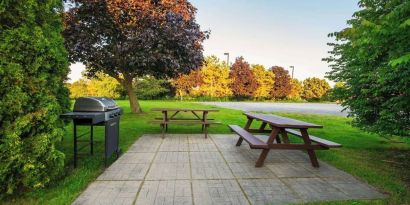 Outdoor picnic and BBQ area at Comfort Inn Kingston HWY 401.