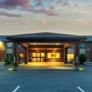 Hotel entrance and parking area at Comfort Inn Kingston HWY 401.