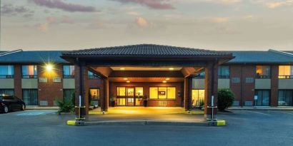 Hotel entrance and parking area at Comfort Inn Kingston HWY 401.