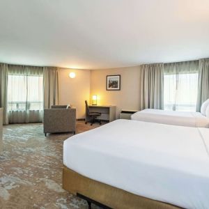 Bright and spacious day use twin room with work desk at Comfort Inn Kingston HWY 401. 