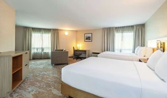 Bright and spacious day use twin room with work desk at Comfort Inn Kingston HWY 401. 