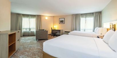 Bright and spacious day use twin room with work desk at Comfort Inn Kingston HWY 401. 