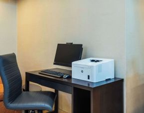 Business center with computer, printer and ergonomic chair at Comfort Inn Kingston HWY 401.