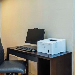 Business center with computer, printer and ergonomic chair at Comfort Inn Kingston HWY 401.