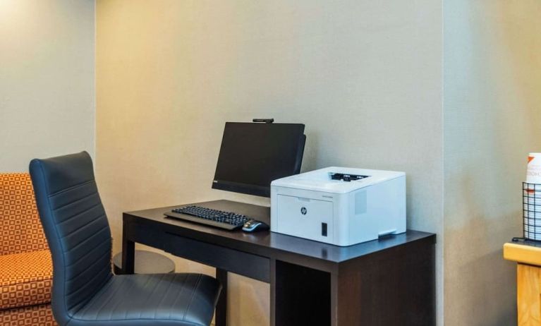 Business center with computer, printer and ergonomic chair at Comfort Inn Kingston HWY 401.