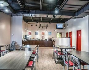 Dining area with comfortable seating at Comfort Inn Laval.