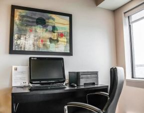 Business center with computer, printer and ergonomic chair at Comfort Inn Laval.