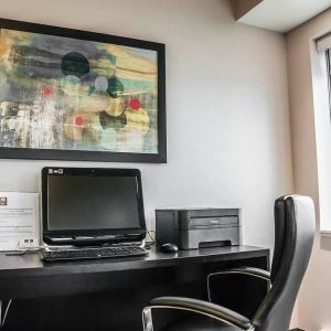 Business center with computer, printer and ergonomic chair at Comfort Inn Laval.