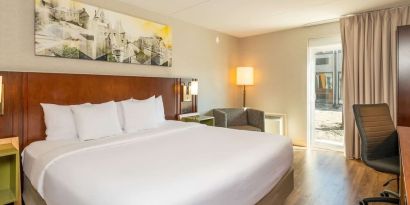 Bright and spacious day use room with sofa, work desk and private bathroom at Comfort Inn Ottawa West.