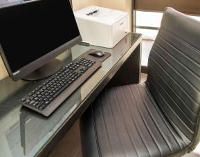 Business center with computer, printer and ergonomic chair at Comfort Inn Ottawa West.