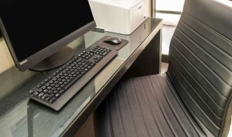 Business center with computer, printer and ergonomic chair at Comfort Inn Ottawa West.