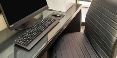 Business center with computer, printer and ergonomic chair at Comfort Inn Ottawa West.