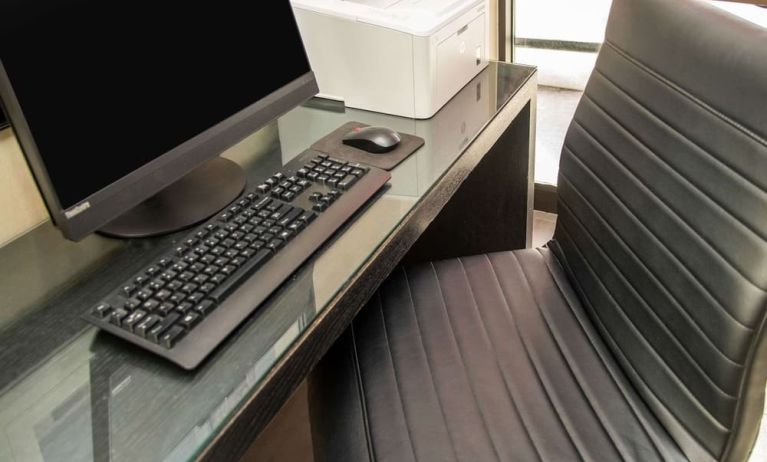 Business center with computer, printer and ergonomic chair at Comfort Inn Ottawa West.