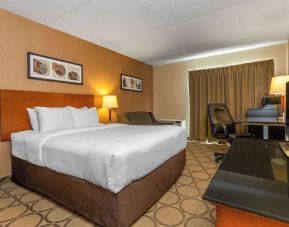 Day use room with TV, work desk, sofa and private bathroom at Comfort Inn Edmundston.