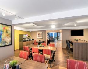 Dining area with comfortable seating perfect for co-working at Comfort Inn Hamilton.