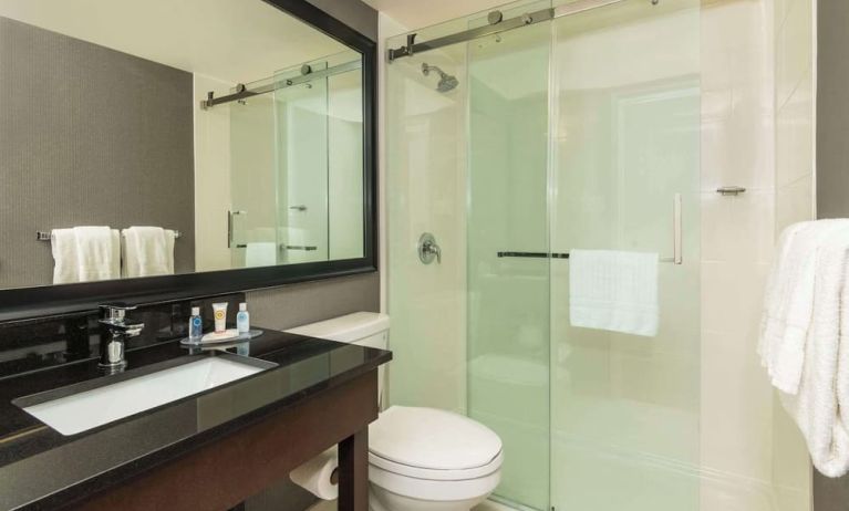 Guest bathroom with shower and free toiletries at Comfort Inn Hamilton.