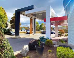 Hotel entrance and parking area at Comfort Inn Dryden.