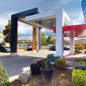 Hotel entrance and parking area at Comfort Inn Dryden.