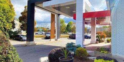 Hotel entrance and parking area at Comfort Inn Dryden.