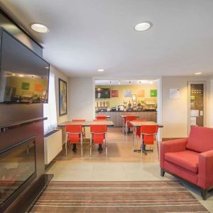 Lobby lounge with fireplace at Comfort Inn Amherst.