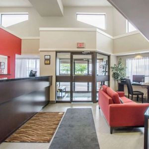 Hotel lobby with lounge area and workspace at Comfort Inn Amherst.