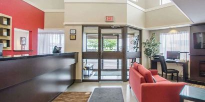 Hotel lobby with lounge area and workspace at Comfort Inn Amherst.