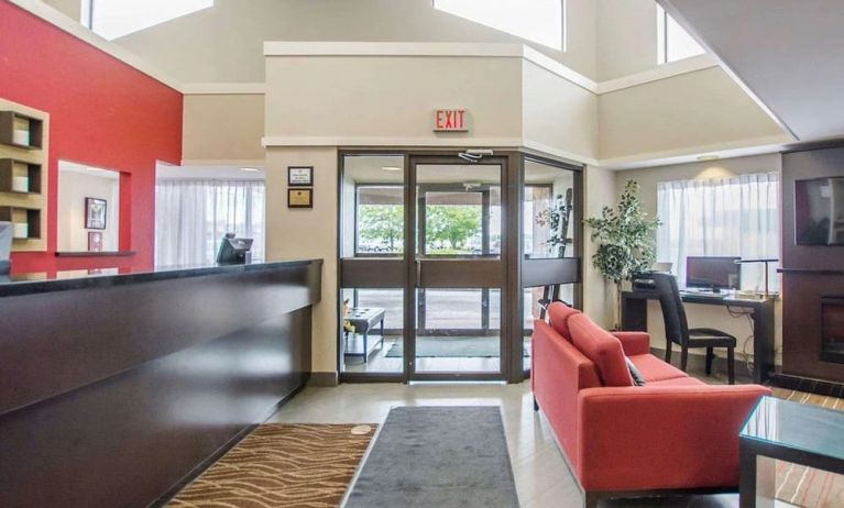 Hotel lobby with lounge area and workspace at Comfort Inn Amherst.