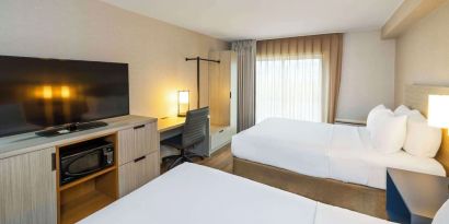 Day use twin room with TV and work desk at Comfort Inn Amherst.