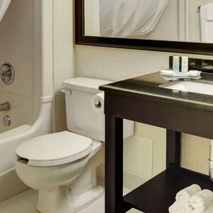 Guest bathroom with tub and free toiletries at Comfort Inn Brantford.
