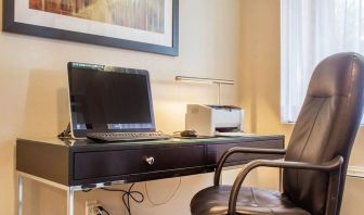 Business center with computer, printer and ergonomic chair at Comfort Inn Brantford.