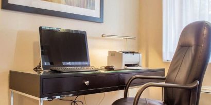 Business center with computer, printer and ergonomic chair at Comfort Inn Brantford.