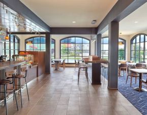 Dining area with comfortable seating, perfect for co-working at Courtyard By Marriott Waterloo St. Jacobs.