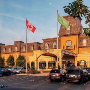 Hotel entrance and parking area at Courtyard By Marriott Waterloo St. Jacobs.