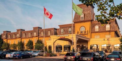 Hotel entrance and parking area at Courtyard By Marriott Waterloo St. Jacobs.