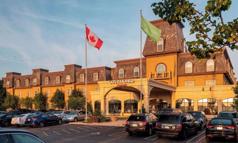 Hotel entrance and parking area at Courtyard By Marriott Waterloo St. Jacobs.