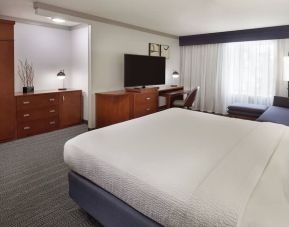 Bright and spacious day use room with TV, work desk, sofa and private bathroom at Courtyard By Marriott Waterloo St. Jacobs.