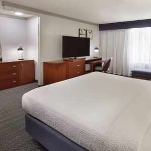 Bright and spacious day use room with TV, work desk, sofa and private bathroom at Courtyard By Marriott Waterloo St. Jacobs.