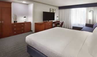 Bright and spacious day use room with TV, work desk, sofa and private bathroom at Courtyard By Marriott Waterloo St. Jacobs.