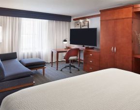 Bright and spacious day use room with TV, work desk, sofa and private bathroom at Courtyard By Marriott Waterloo St. Jacobs.