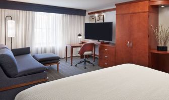 Bright and spacious day use room with TV, work desk, sofa and private bathroom at Courtyard By Marriott Waterloo St. Jacobs.