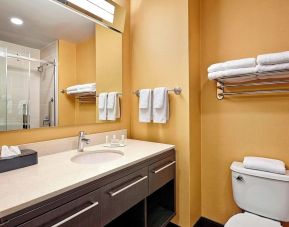 Guest bathroom with shower and free toiletries at TownePlace Suites By Marriott London.