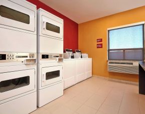 Laundry room at TownePlace Suites By Marriott London.