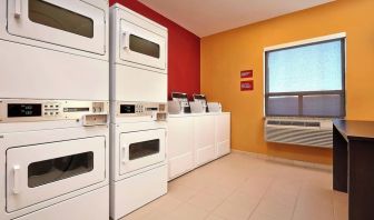 Laundry room at TownePlace Suites By Marriott London.