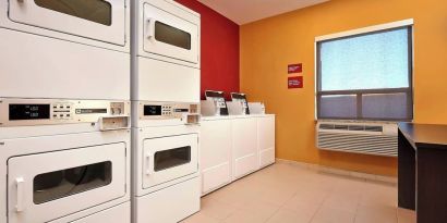 Laundry room at TownePlace Suites By Marriott London.