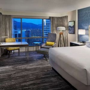 Day use room with TV, work desk and sofa at Hyatt Regency Vancouver.