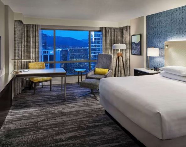 Day use room with TV, work desk and sofa at Hyatt Regency Vancouver.