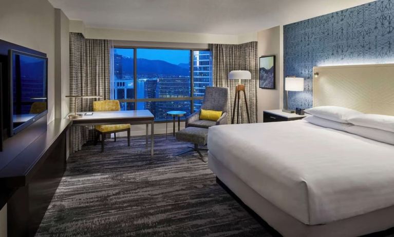 Day use room with TV, work desk and sofa at Hyatt Regency Vancouver.