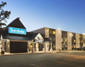 Hotel exterior and parking area at Travelodge Edmonton South.