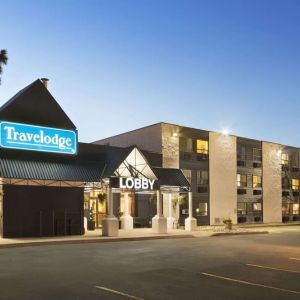 Hotel exterior and parking area at Travelodge Edmonton South.